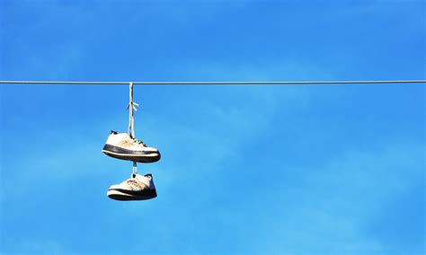 tennis shoes on wire meaning